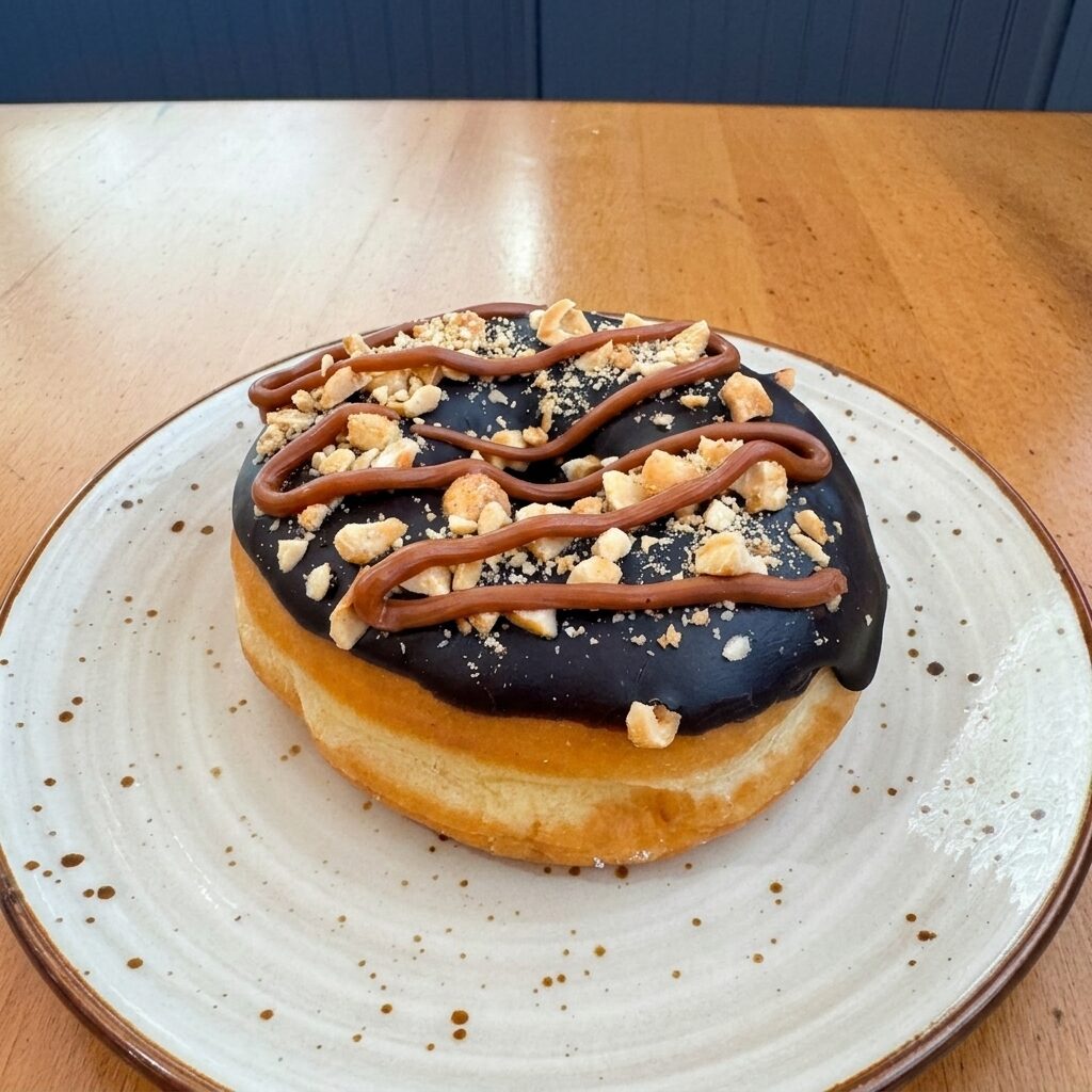 Chocolate Oreo donut with chunky Oreo crumbles
